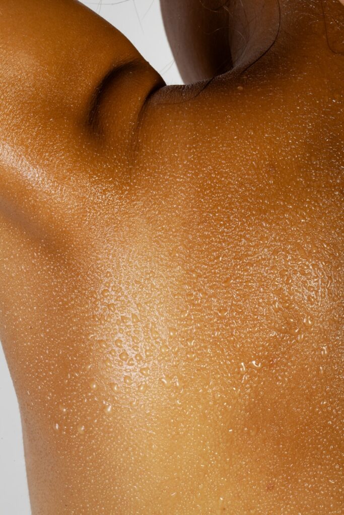 Close-up of sweaty skin with water droplets